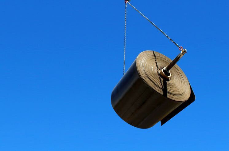 Bulk roll on spreader beam